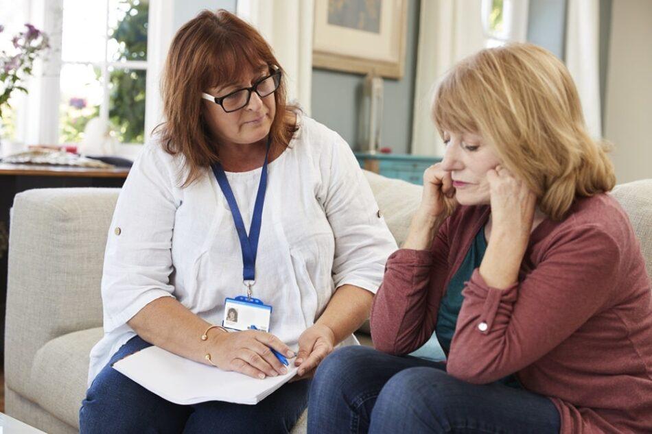 Social worker talking to a woman