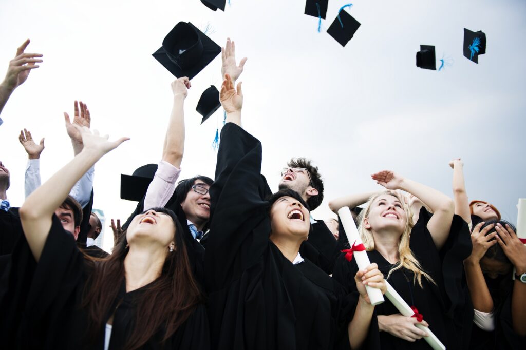 Graduates throw their hats in the air