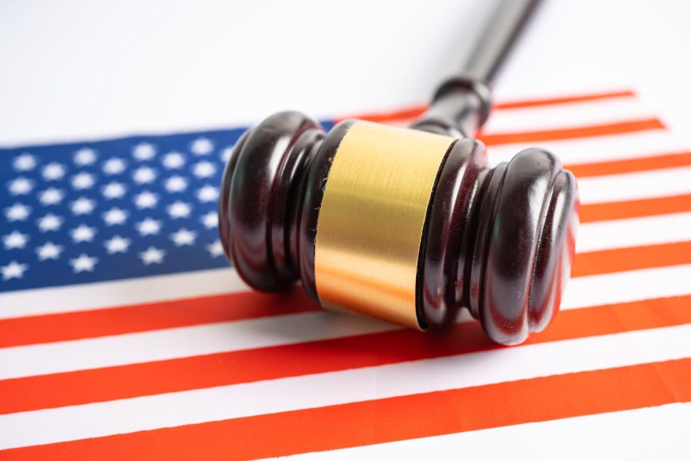 Gavel on top of miniature US flag
