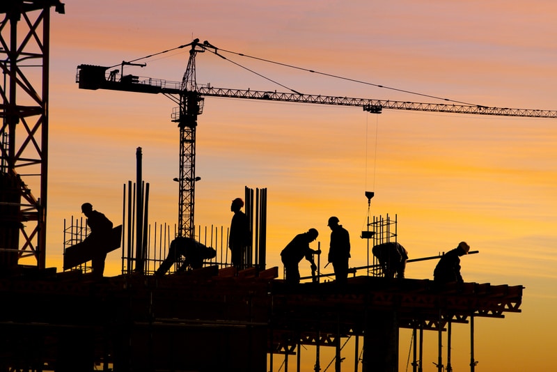 construction workers up on a construction site