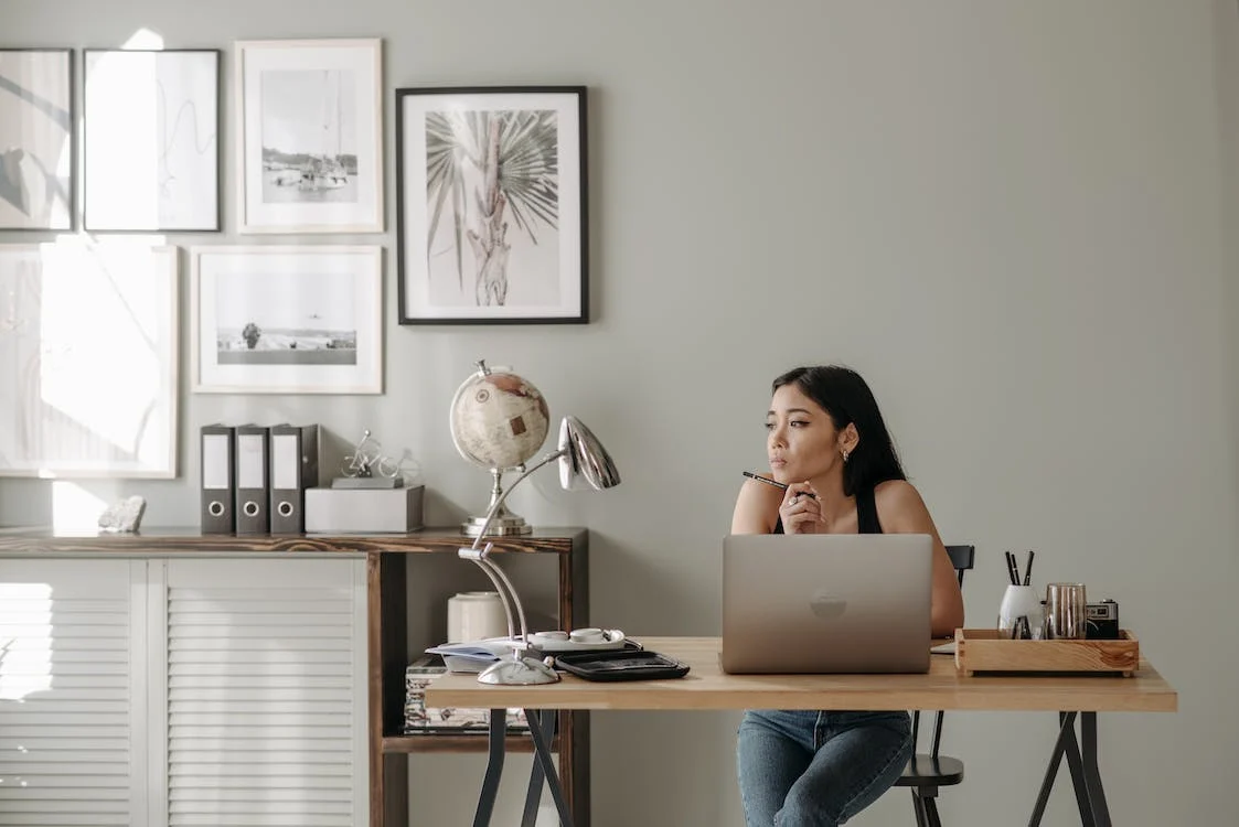 A woman works at her desk