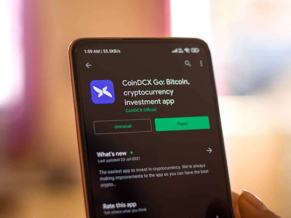 CoinDCX logo on phone screen