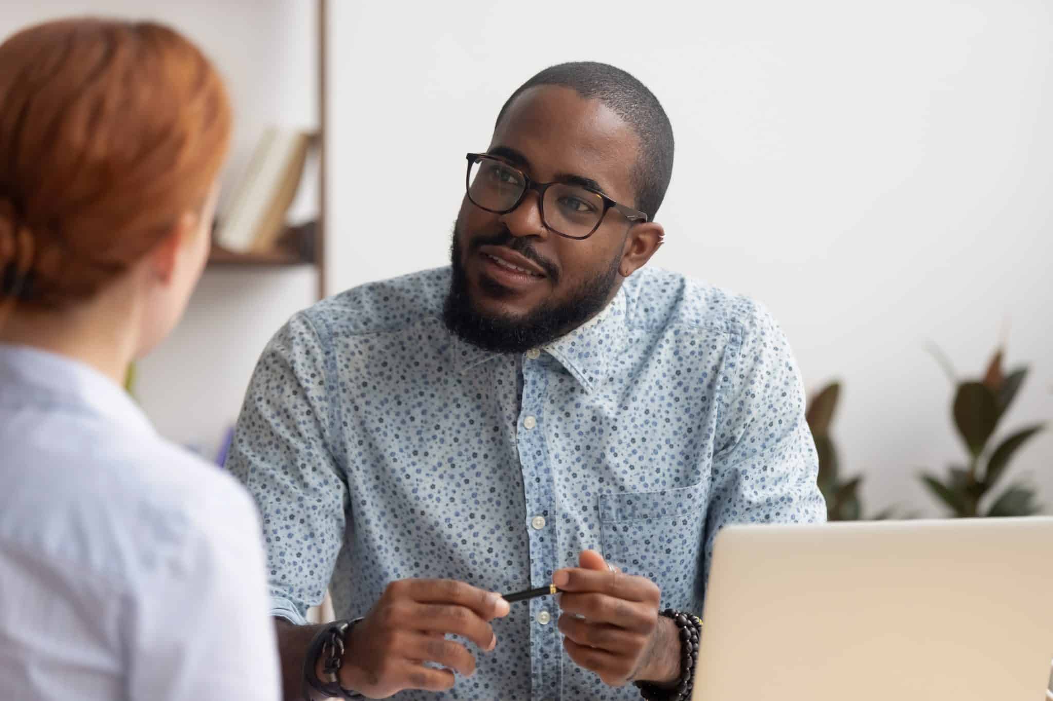 man interviewing woman