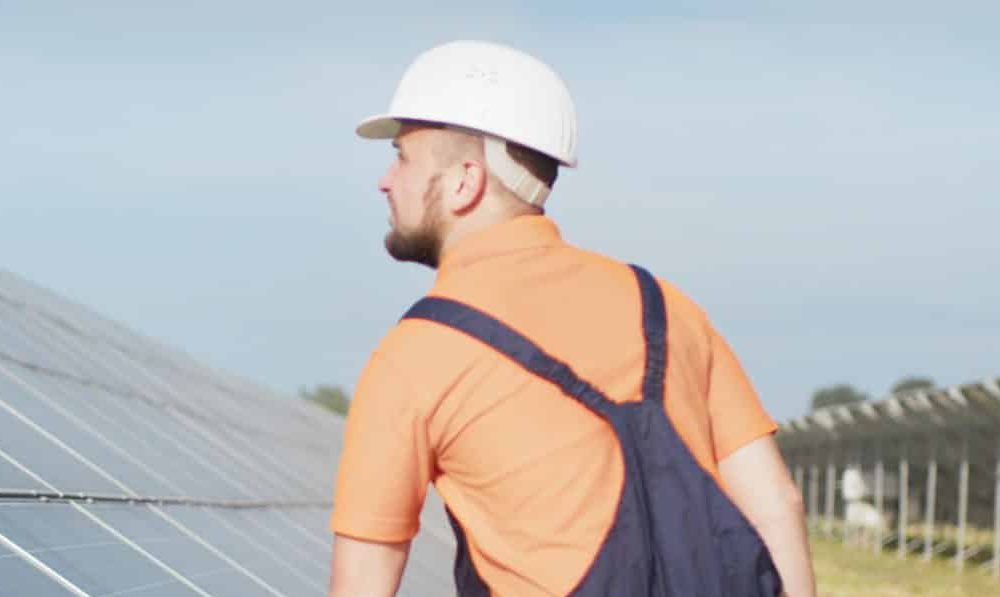 Man setting up solar panels