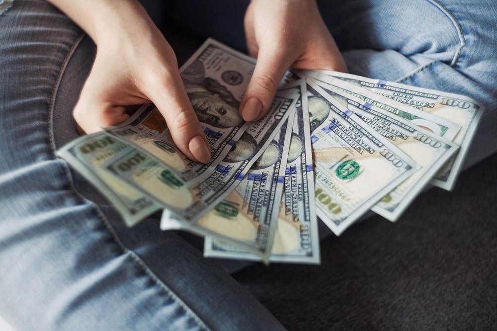 A handle full of dollars
