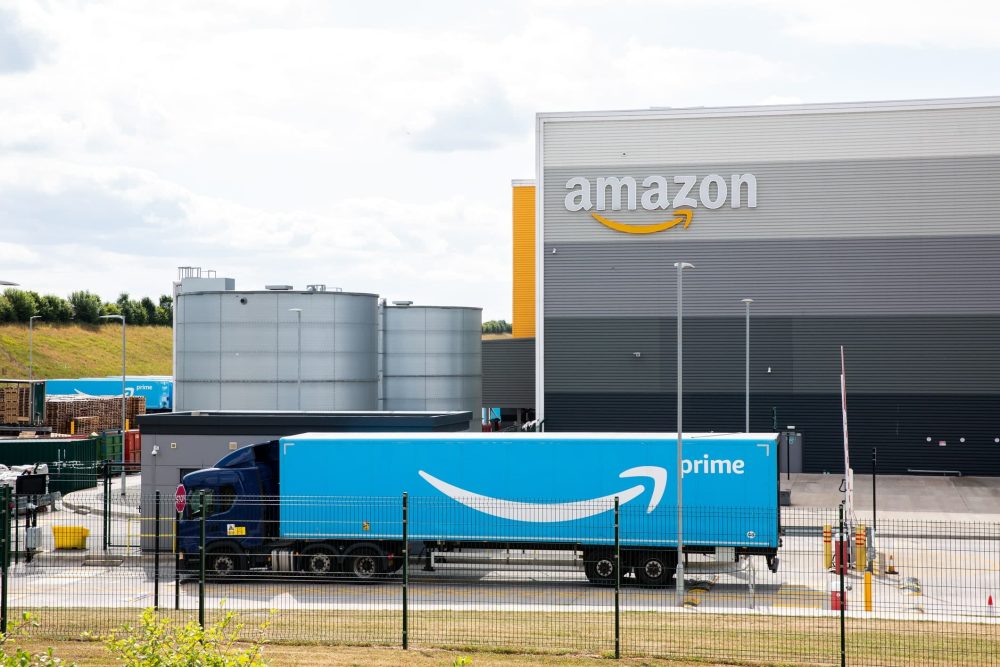 An Amazon Prime truck arriving at an Amazon warehouse in the UK