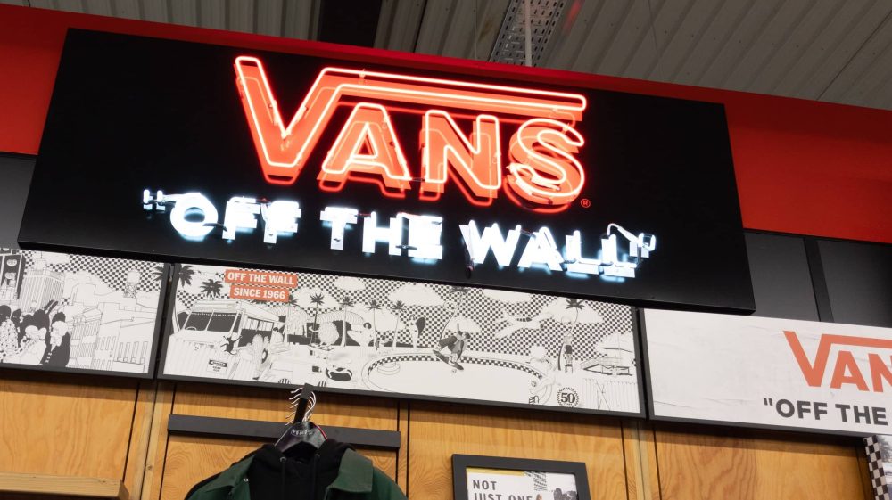 Vans brand logo and text sign front of skate store