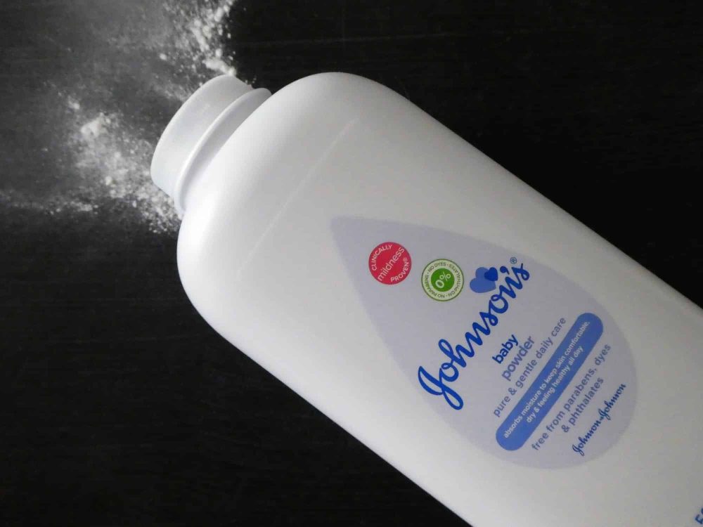 Johnson`s Baby Powder on a black background