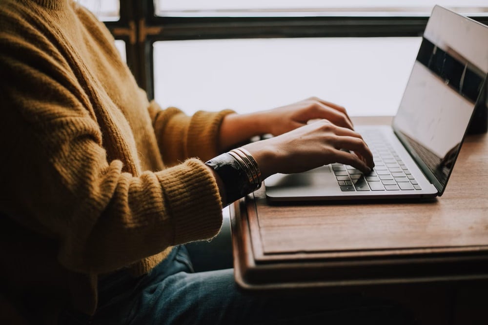 Woman works on a laptop