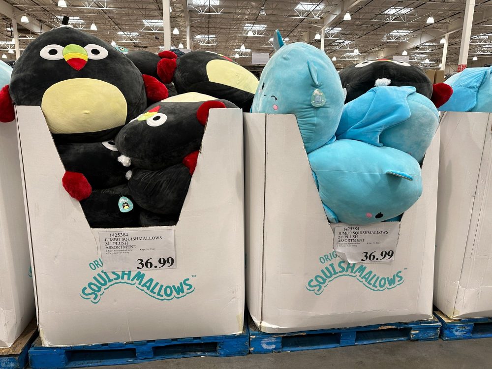 Display of jumbo-sized Squishmallows plush toys at a Costco store