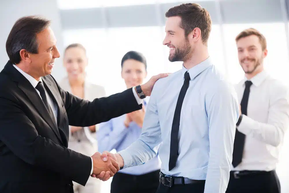 An employer shaking an employees hand