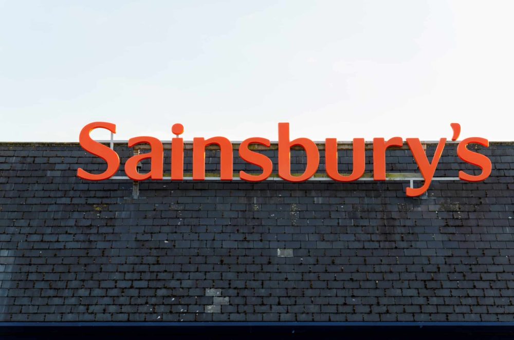 Sainsbury`s supermarket logo as a rooftop sign