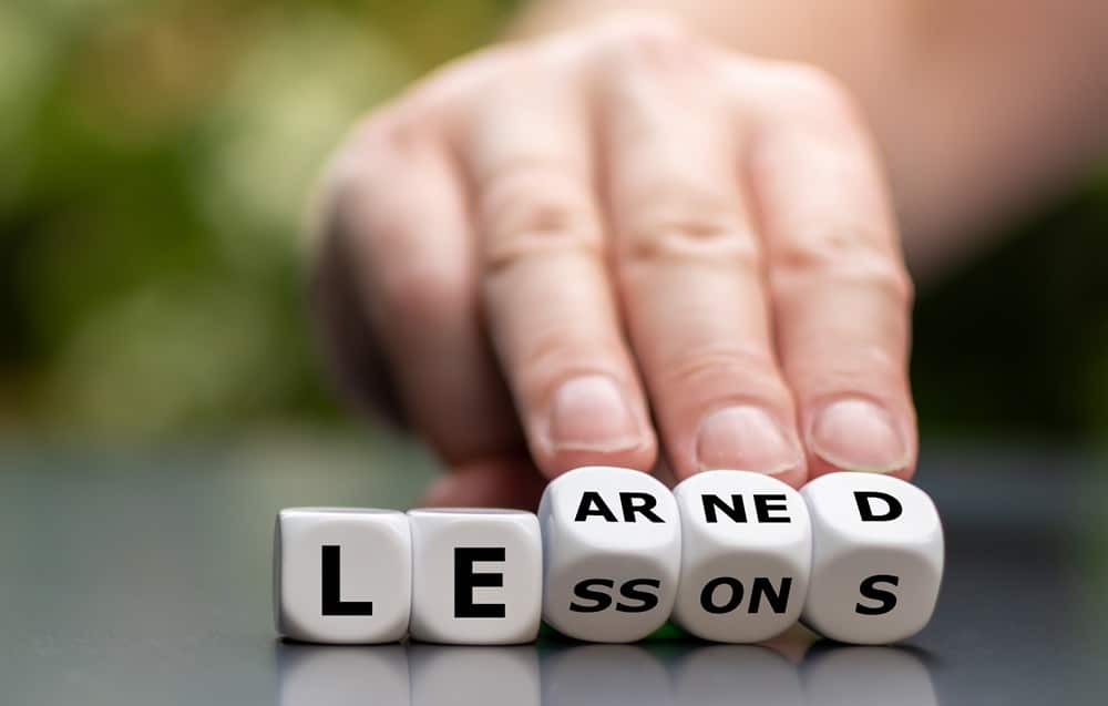 Someone rolling diceover from it saying Lessons to Learned