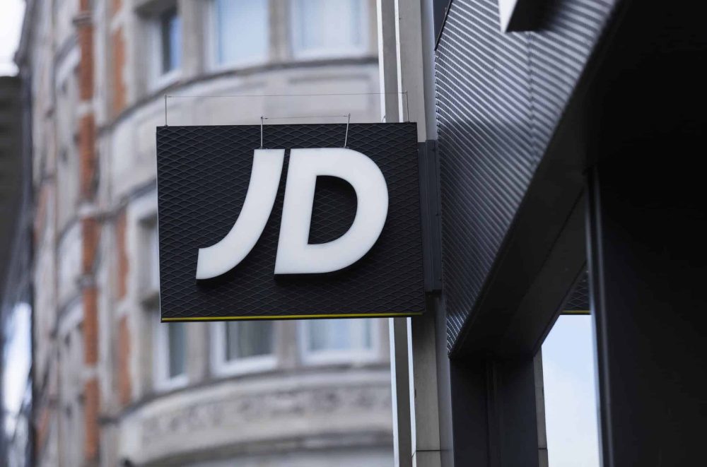 A sign and logo for JD Sports Store