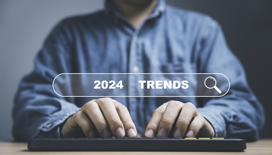 Man typing 2024 jobs trends on his keyboard