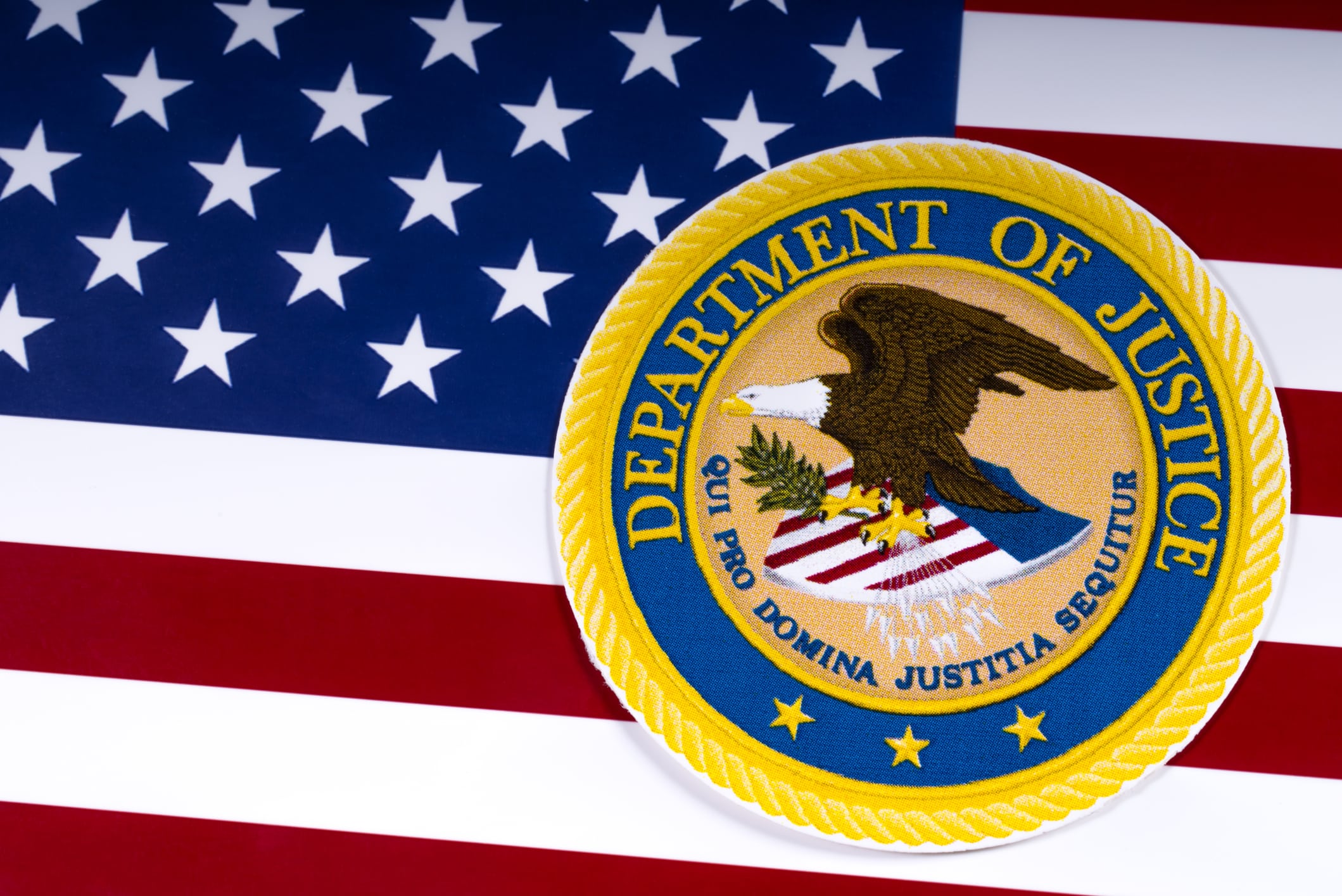 USA flag with the Department of Justice logo on it