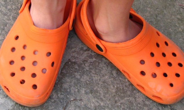 A pair of orange crocs