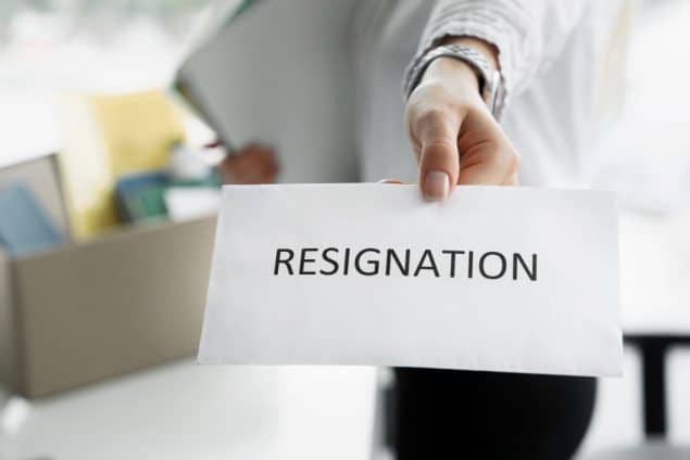 Person writing a resignation letter