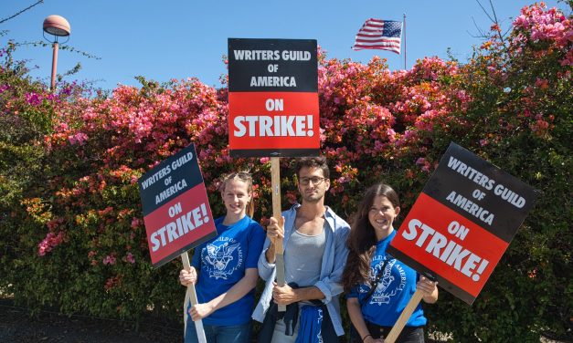 Striking Writers Guild presses Comcast and Netflix shareholders to waive massive executive pay