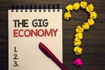 Notepad with 3 bullet points saying the gig economy as a header