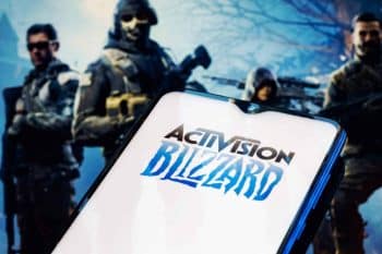 Activision Blizzard logo on a phone screen with the background of the Call of Duty