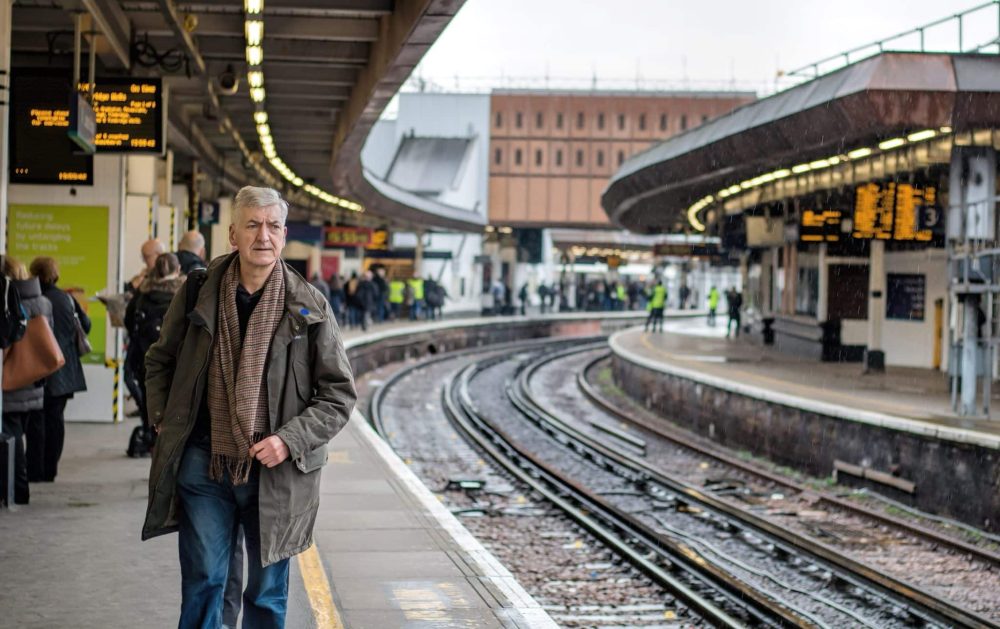 Man waiting for a train in London Bridge railway station