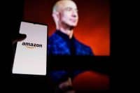 Amazon logo on screen and Jeff Bezos