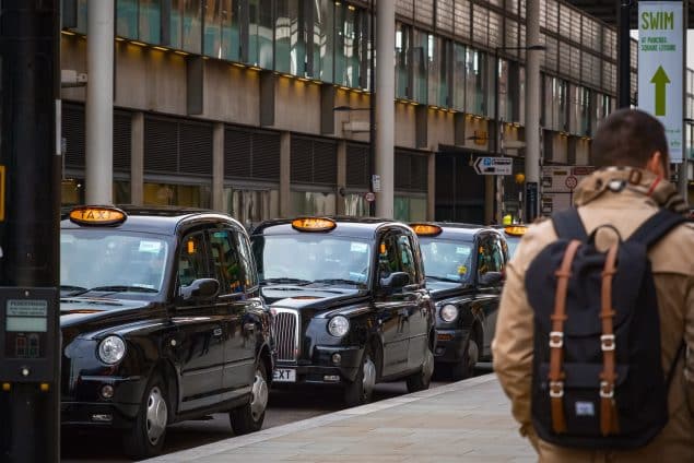 London black cabs queuing at a cab stand outside Kings Cross station