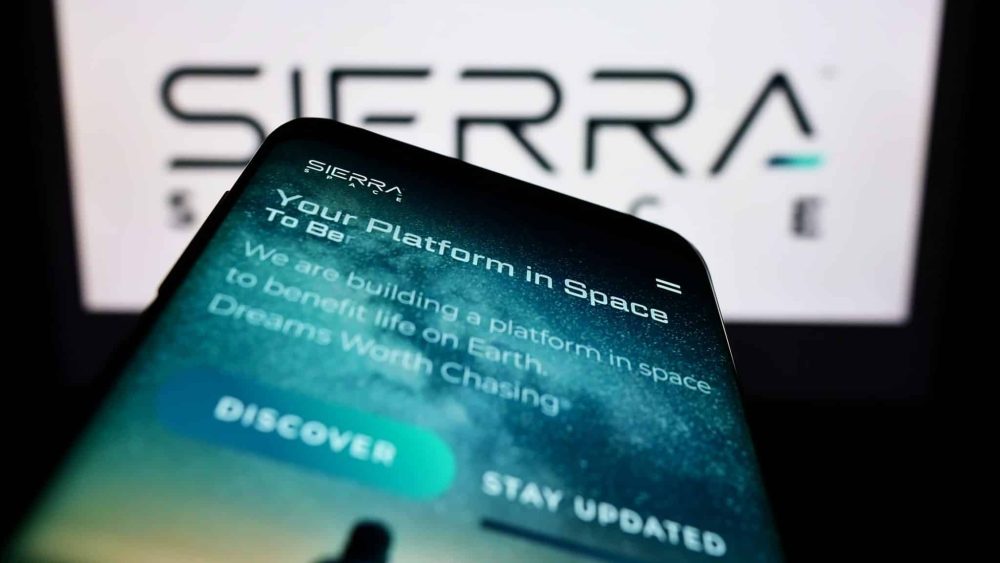 Aerospace company Sierra Space website on phone with its logo in the background