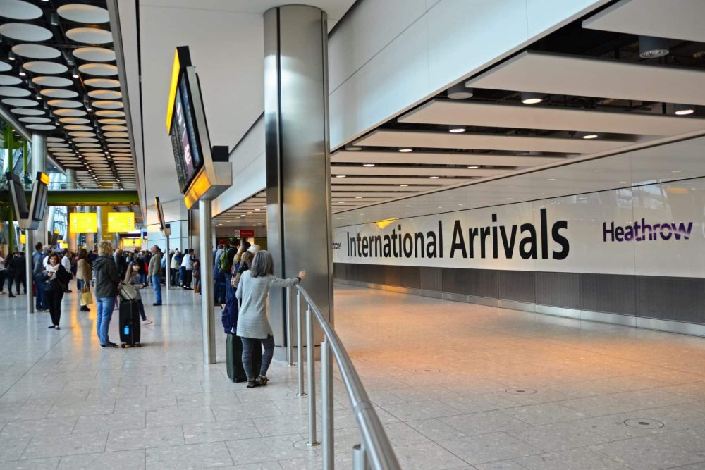 People waiting at the International arrivals exit in Heathrow Airport