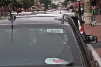 Uber and Lyft sticker inside a car