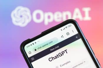 ChatGPT displayed on phone screen and OpenAI in the background