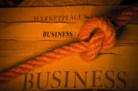 Business letters with a rope tied around them