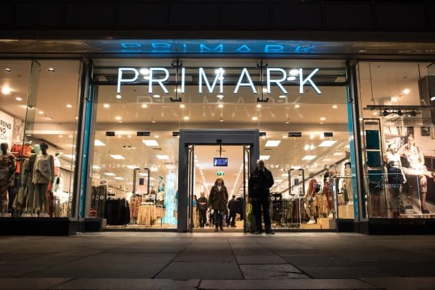 Exterior Night Shot of Illuminated entrance to Primark Fashion Clothing Shop