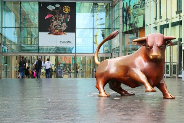 The iconic Bull outside the Bullring Shopping Centre stands as a symbol of Birmingham's commercial vibrancy and its spirit of regeneration and growth." "Bronze bull statue in front of the Bullring Shopping Centre, a symbol of Birmingham's bustling retail heart.