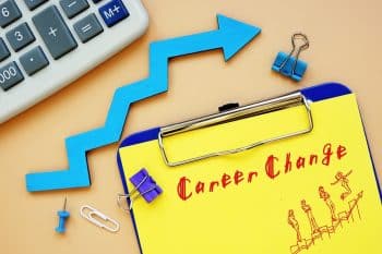 the words career change on a notepad and an arrow pointing up