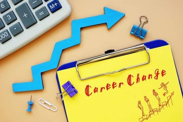 the words career change on a notepad and an arrow pointing up