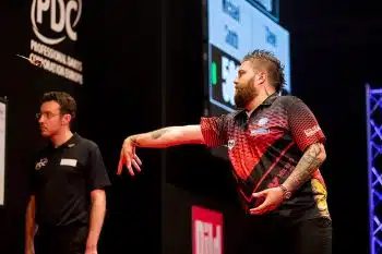 Darts player Michale Smith throwing a dart