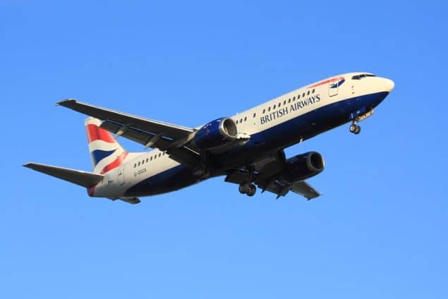 A British Airways jet flies through the sky