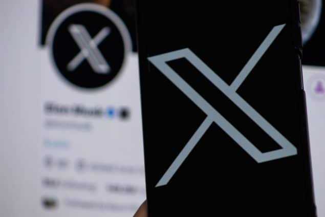 X logo on phone screen