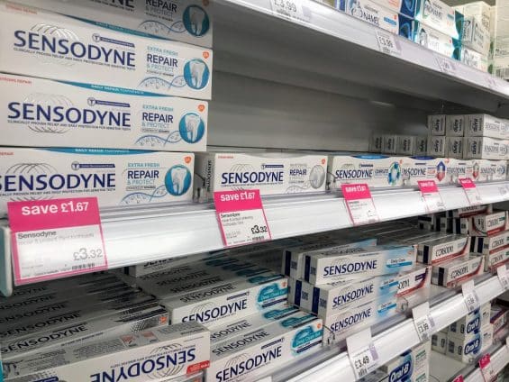 Sensodyne toothpaste on shelves of a store